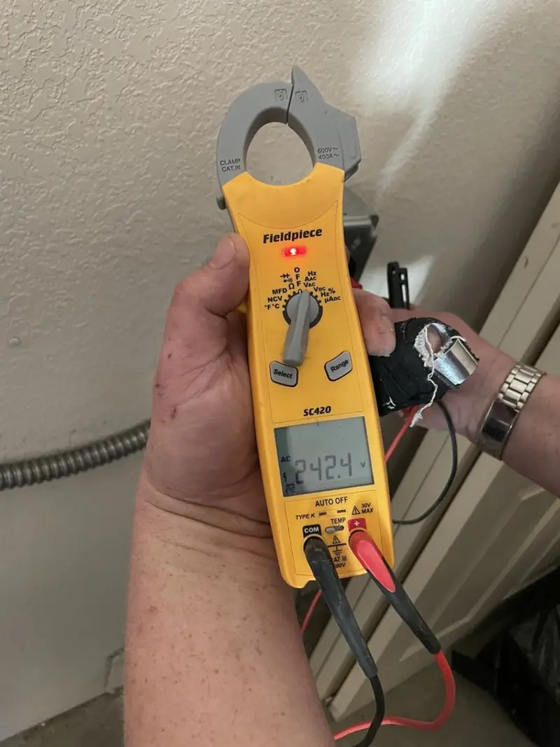 Voltage testing with clamp meter during Generator Installation in Morgan